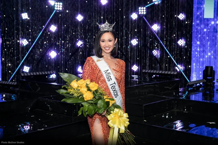 A photograph of Miss Texas 2022. She is beaming at the camera.